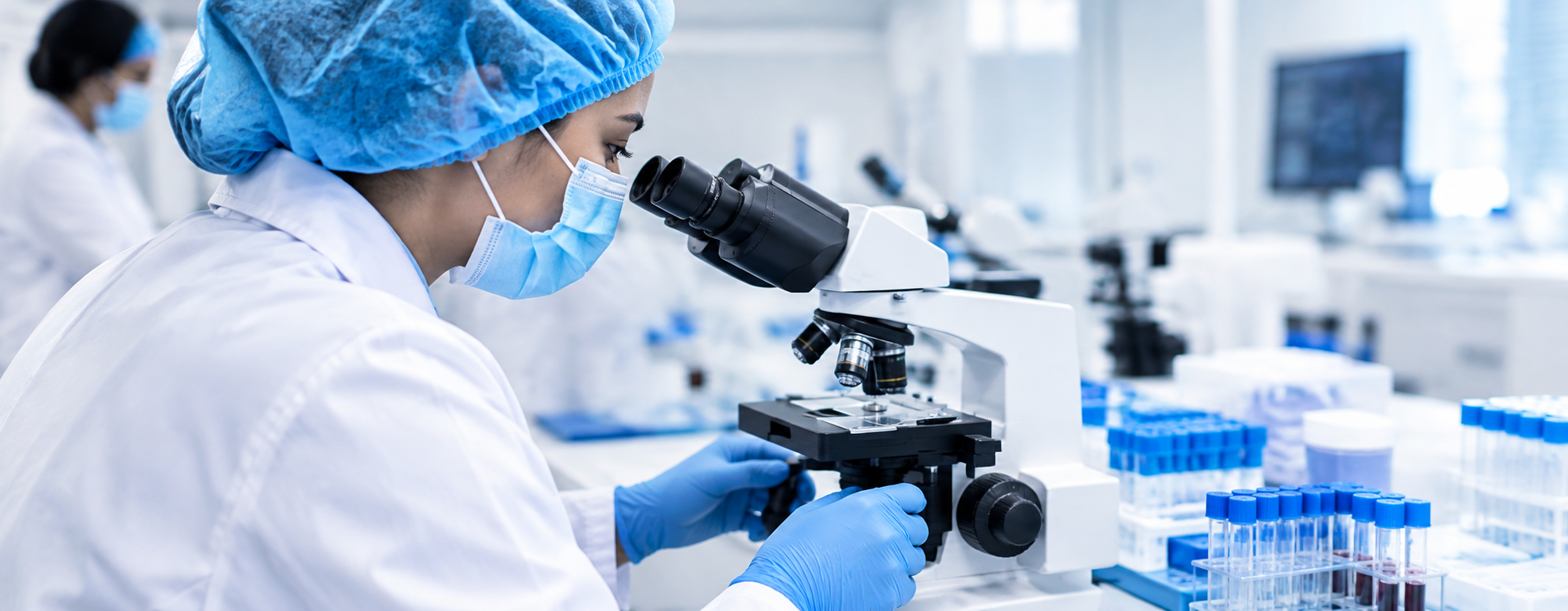 focused scientist at the microscope